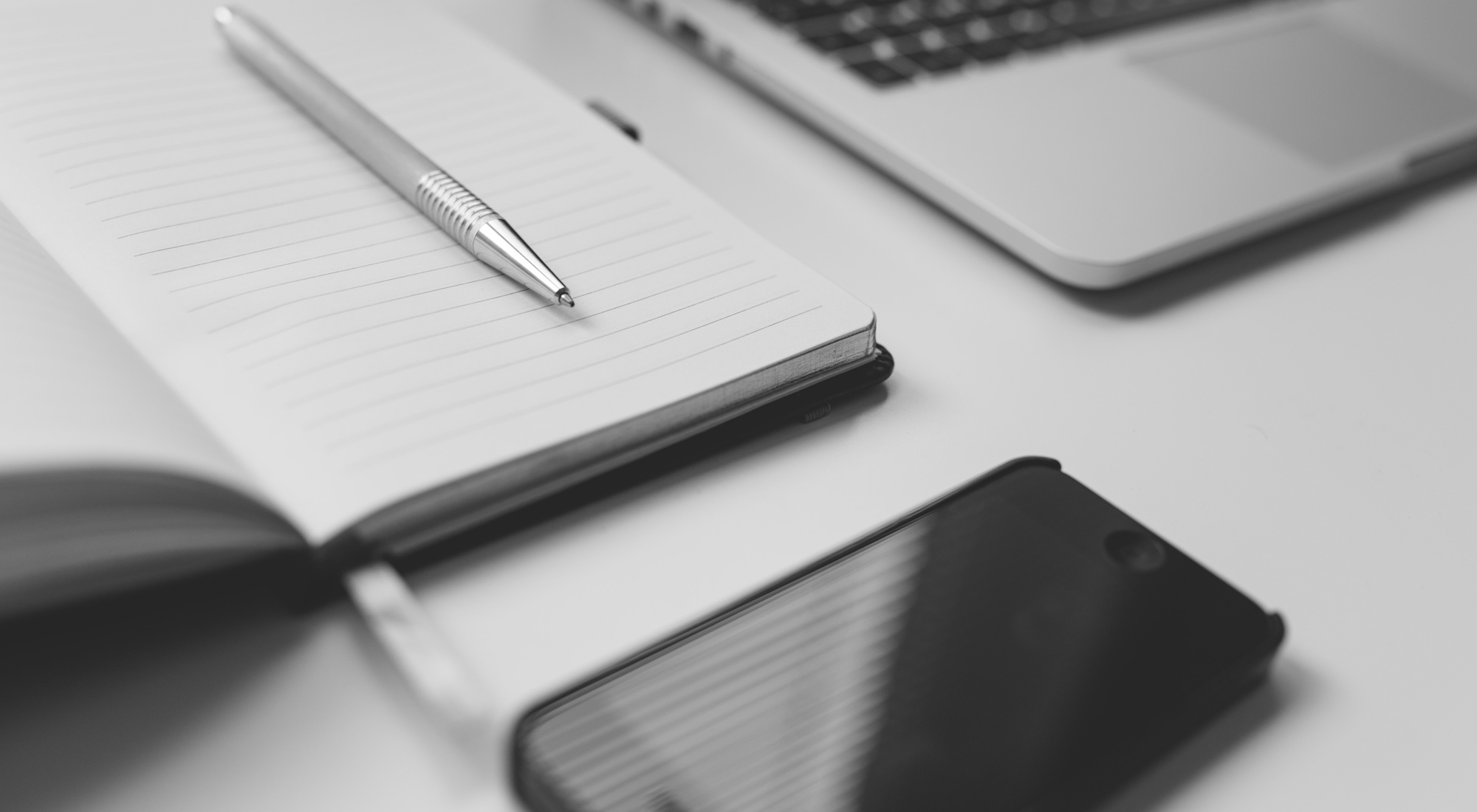 close-up of laptop and phone