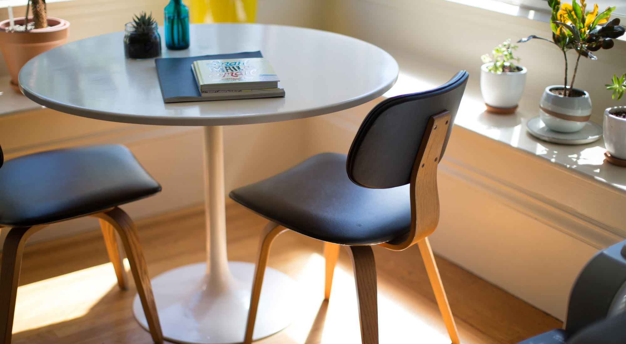 table with books on it and with chairs